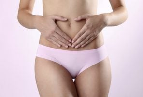 Woman's hands on stomach