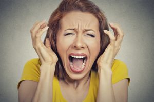 Menopausal rage: angry woman screaming